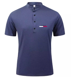 Detailed view of dark blue mesh polo shirt with Paris chest logo and standing collar