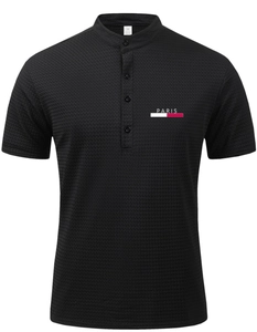 Detail of black mesh polo shirt showing stand-up collar and PARIS chest embroidery