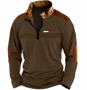 Detail of olive green quarter-zip polo with contrast shoulder patches and PARIS print