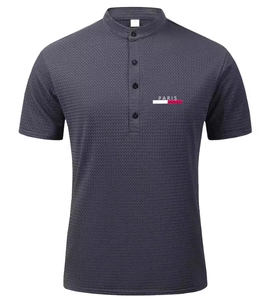 Detail of dark grey polo shirt showing mandarin collar, buttons and Paris logo mesh