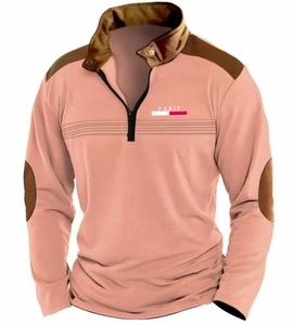 Detail of peach long sleeve polo shirt with brown stitching and Paris logo on chest