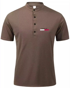 Detail of waffle knit fabric and Paris print on a men's brown short sleeve Henley shirt