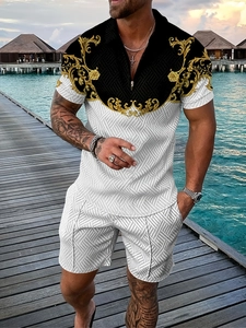 Detailed close-up of men's polo set featuring gold Baroque patterns and breathable fabric