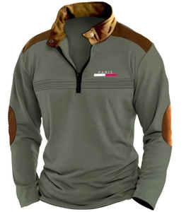 Detail of olive green long sleeve polo shirt showing shoulder patches and Paris print