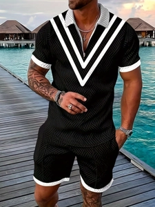 Men's black summer polo set with white V-pattern and textured knit fabric on tropical background