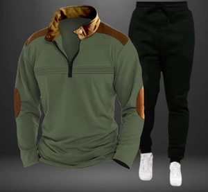 Detail of army green polo sweatshirt with brown leather patches and black joggers