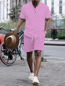 Detailed view of pink men summer set with white geometric patterns and Henley neckline