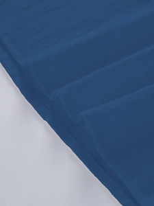 Detailed texture of navy blue cotton linen fabric showing breathable weave and soft creases