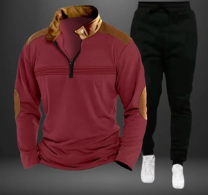 Detail of burgundy long sleeve polo shirt with brown shoulder patches and zip collar