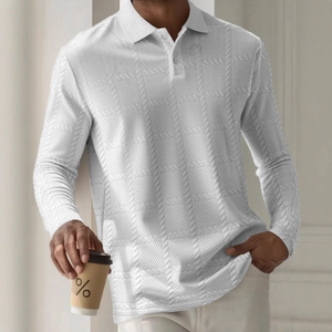 Detailed macro view of white long-sleeved polo shirt with textured waffle knit pattern