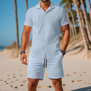 Men's summer short sleeve shirt and shorts set with textured fabric on a sunny beach