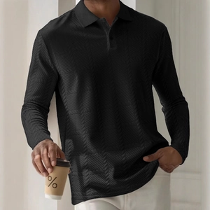 Detail shot of men's black long sleeve polo shirt featuring textured herringbone knit fabric