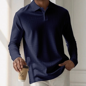 Detailed view of dark blue long-sleeve polo shirt with refined geometric knit texture