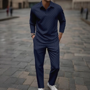 Detail shot of navy blue long sleeve polo and pants set with premium chevron texture
