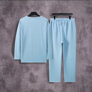 Detail of light blue men's loungewear set showing knit texture and elastic waist