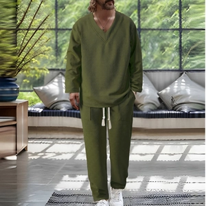 Detailed texture of olive green waffle knit fabric on men's V-neck casual set