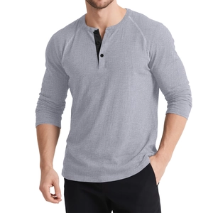 Detail showing the gray waffle-knit fabric and three-button neckline of the Henley shirt