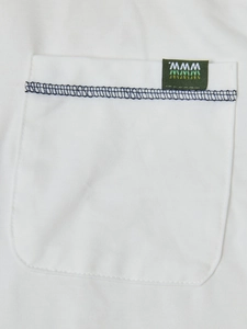 Close-up of white Henley shirt pocket with black stitching and small green woven label