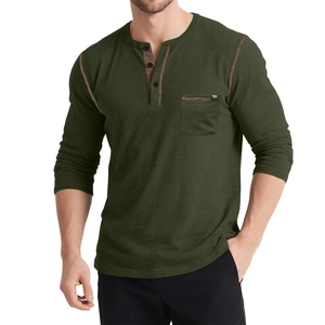 Detailed close-up of dark olive green Henley shirt with contrast orange stitching and pocket