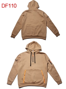 Detail of khaki fleece hoodie with orange zipper pocket and utility sleeve compartments