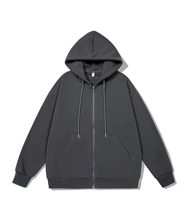 Detail of charcoal grey zip-up hoodie featuring ribbed cuffs and metal zipper closure