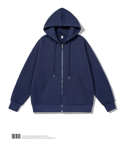 Close-up of navy blue zip-up hoodie featuring metal zipper and drawstring detail