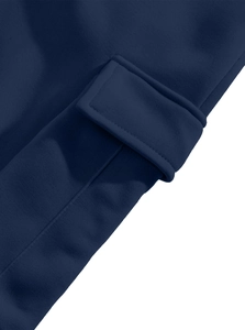 Detail of cargo pants side pocket with durable stitching in deep navy blue knit fabric