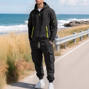 Men's black thermal hoodie and cargo pants set with neon yellow zipper details