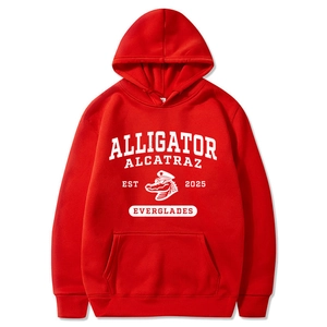 Detailed view of red hoodie with Alligator Alcatraz graphic and kangaroo pocket design