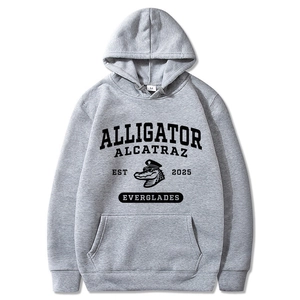 Detail of grey Alligator Alcatraz hoodie showing print, drawstring hood, and pocket