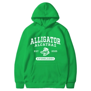 Detail of green hoodie featuring vintage alligator alcatraz graphic and kangaroo pocket