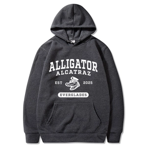 Close-up of Alligator Alcatraz screen print on dark charcoal grey hooded sweatshirt