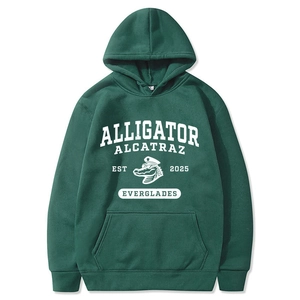 Detail of dark green hoodie featuring white screen-printed alligator graphic and kangaroo pocket