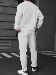 Detail of white men's tracksuit with chevron texture showing the full back silhouette