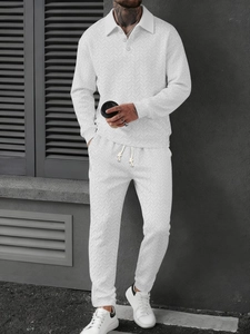 Detail shot of white long-sleeve polo set featuring unique herringbone knit texture