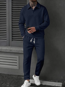 Close-up of navy blue men's polo set showing 3D knit texture and drawstring details
