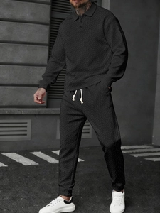 Detail of men's polo set showing herringbone knit texture and drawstring waist design