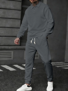 Detail of grey polo long sleeve set showing wheat texture fabric and drawstring waist