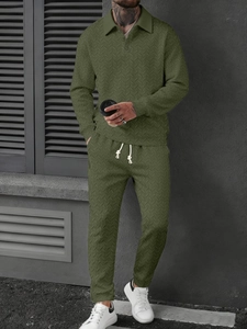 Detail of olive green polo set showing the unique wheat pattern texture and white drawstrings