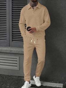 Close-up of beige men's polo set featuring premium textured knit and drawstring waist