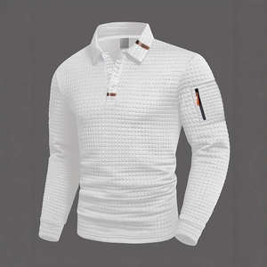 Detail of white waffle texture polo shirt with orange zipper pocket and brown collar trim
