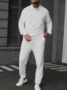 Detail shot of men's white long sleeve polo set featuring premium herringbone texture fabric