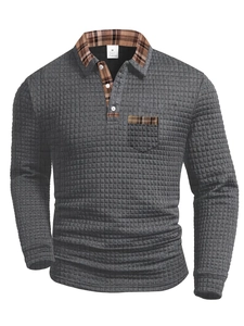 Close-up of waffle texture fabric and plaid patchwork detail on a men's polo shirt