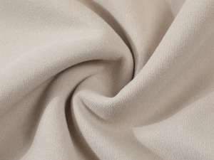 Close-up of premium oatmeal knit fabric showing soft texture for men's hoodies