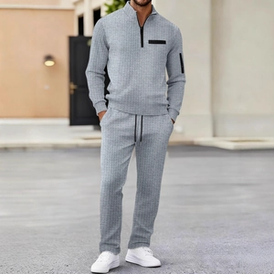 Men's grey waffle knit two-piece set with half-zipper polo collar and casual trousers