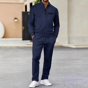 Men's navy waffle knit two-piece tracksuit with quarter-zip polo and drawstring trousers
