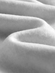 Macro shot of soft white fleece fabric texture for men's casual hooded sweatshirt sets