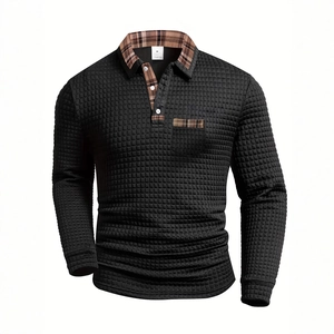 Men's black waffle textured long sleeve polo shirt with plaid collar and pocket detail