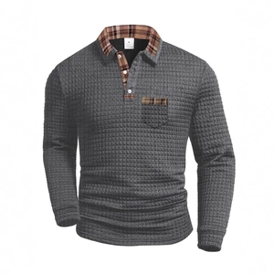 Men's dark grey long sleeve waffle polo shirt with brown plaid collar and pocket