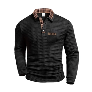 Men's black waffle textured long sleeve polo shirt with brown plaid pocket and collar detail
